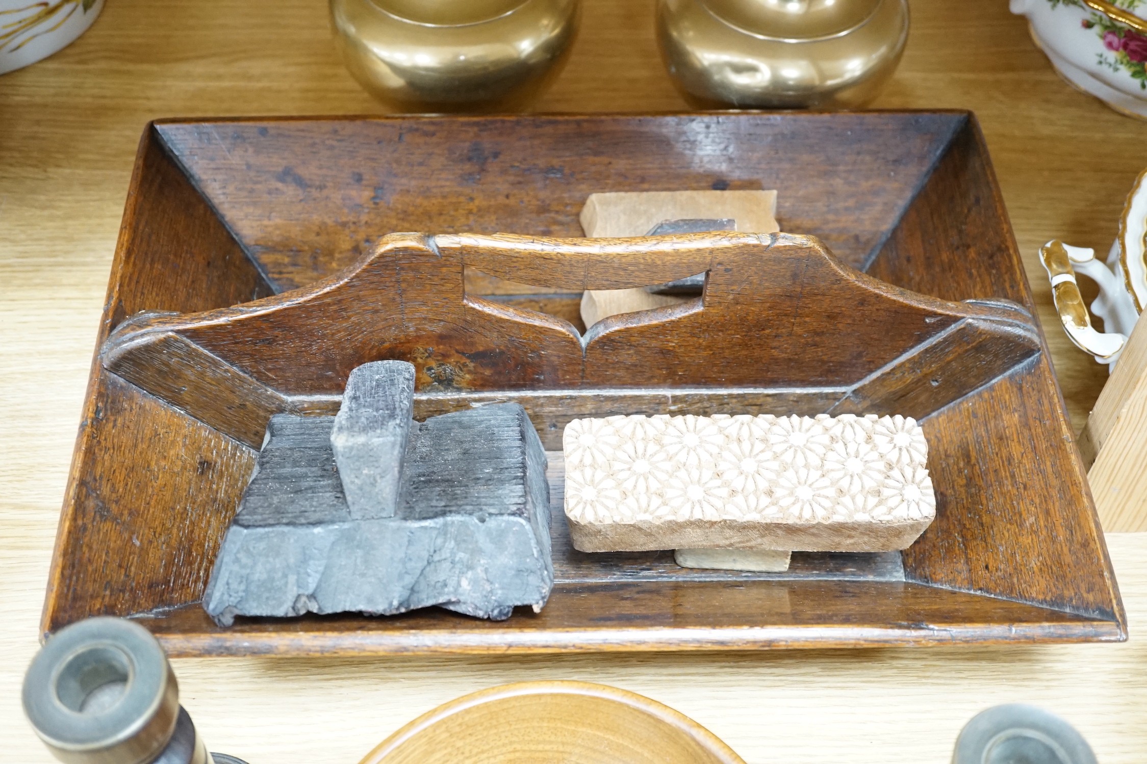 A wooden cutlery box, 42cm wide, together with carved patterned printing blocks, and other miscellaneous items
